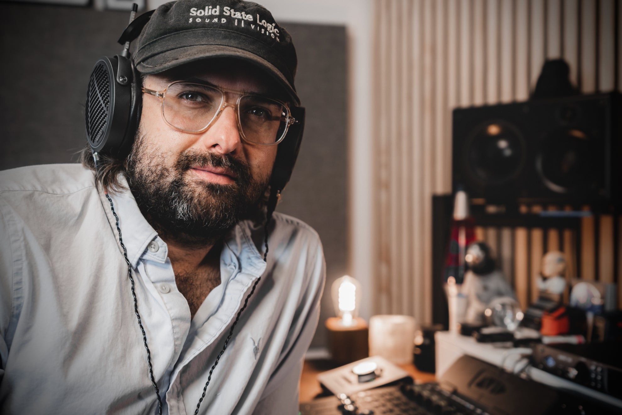 Daniel Holsinger in his studio with his Audeze MM-500 headphones