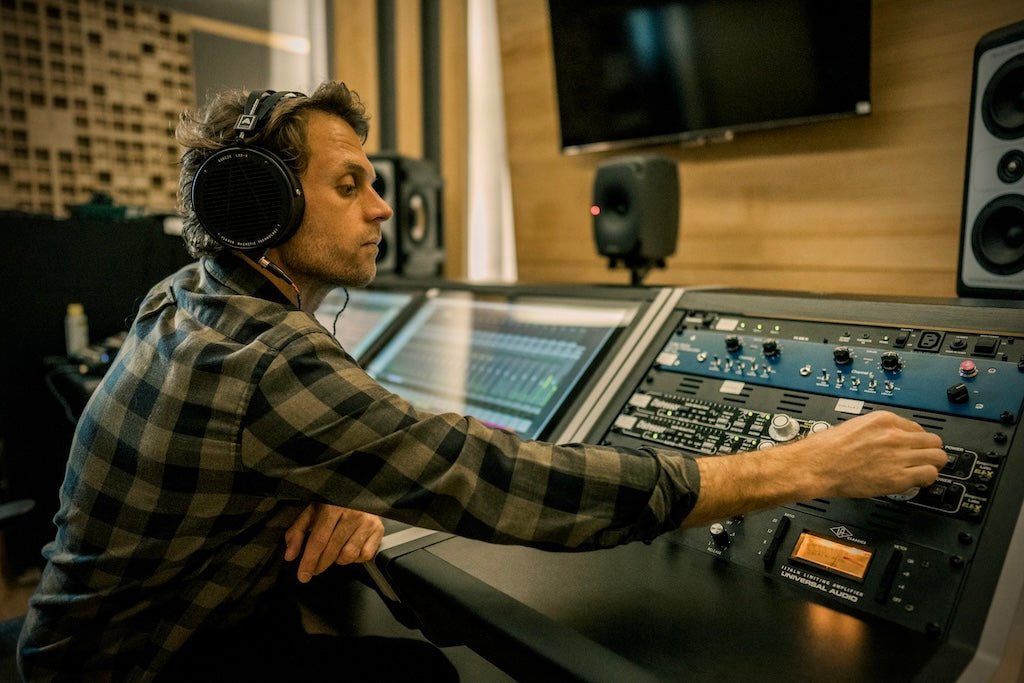 Dane Taylor wearing Audeze LCD-X headphones in the studio