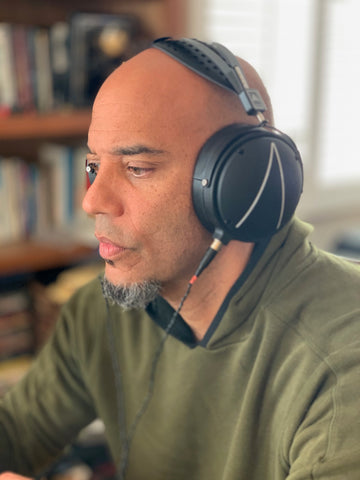 Jazz bassist and composer Eric Revis poses with his LCD-2 closed back headphones