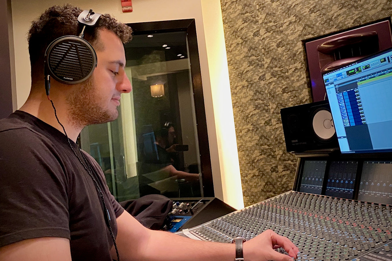 Johnny “BACEFACE” Ayoub in the studio with his Audeze MM-500 headphones