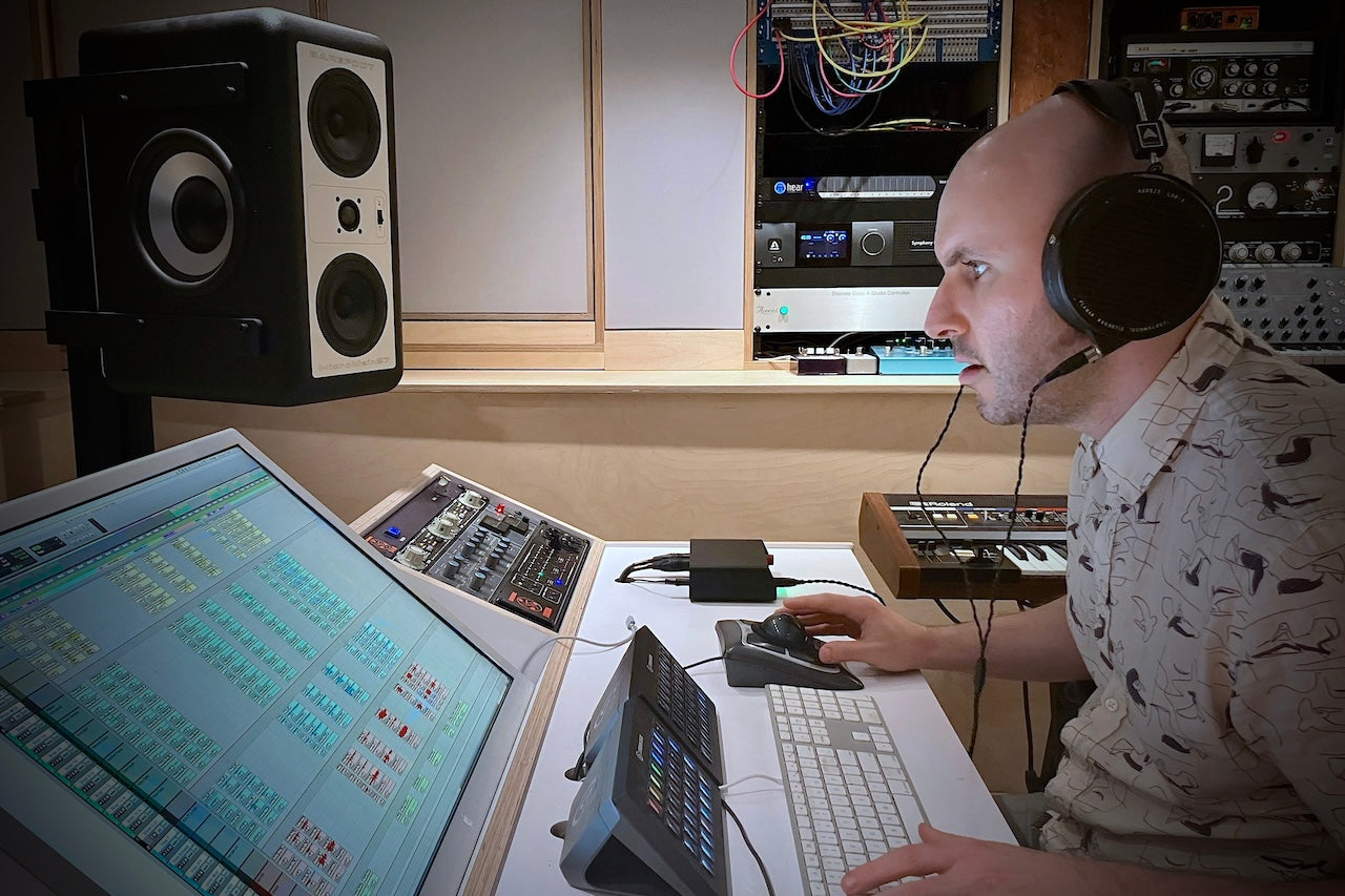 Joseph wearing Audeze LCD-X headphones in studio