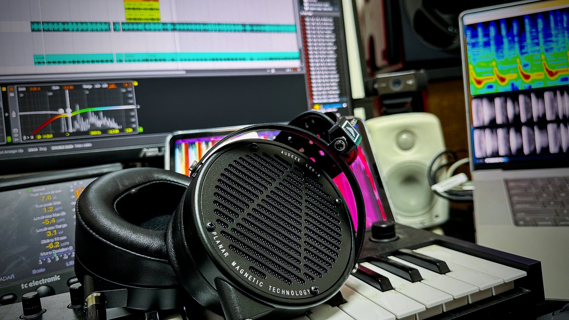 LCD-X Headphones laying in Moar's Workspace