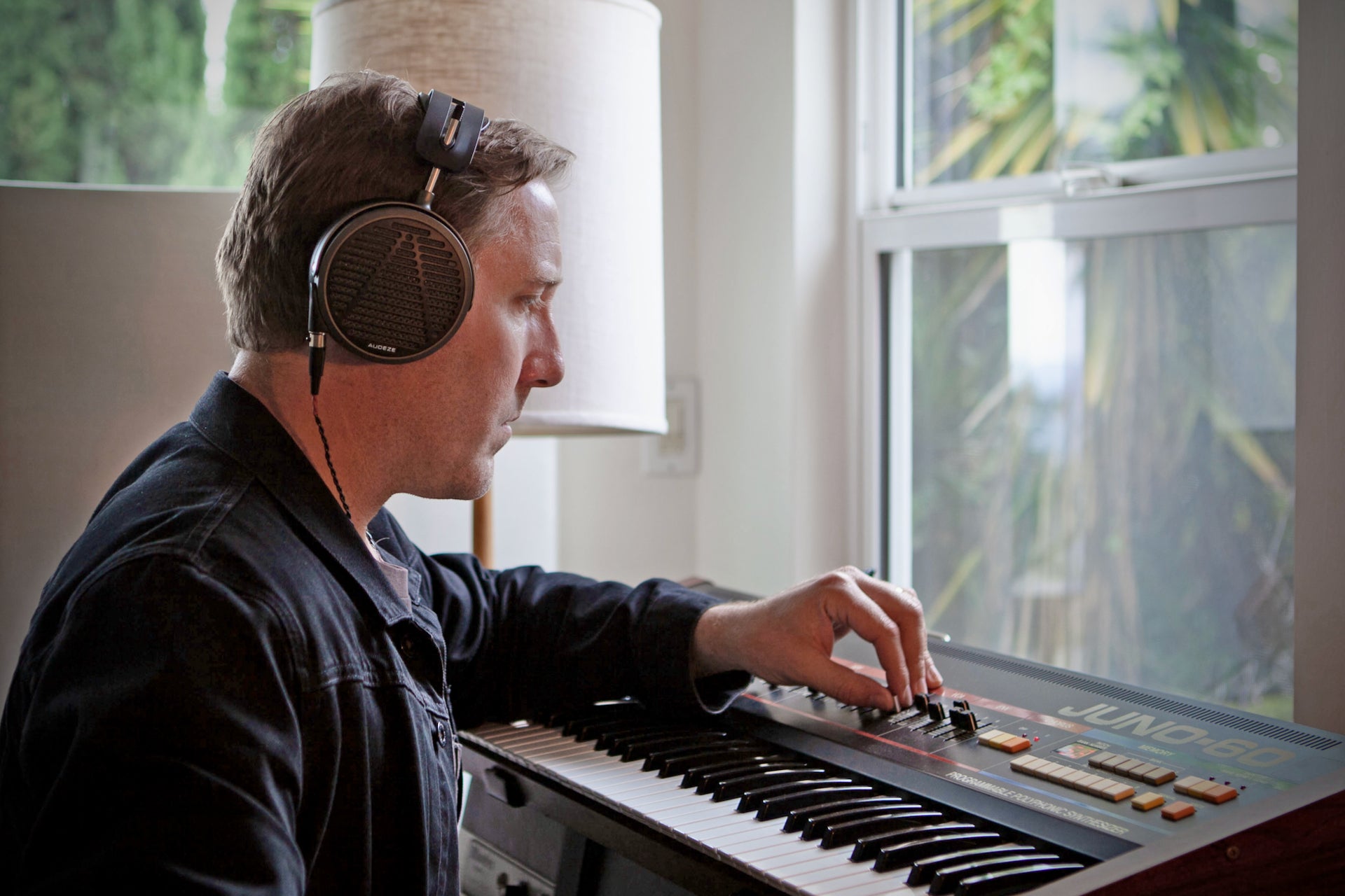 Michael A. Muller in the studio with his Audeze MM-500 headphones