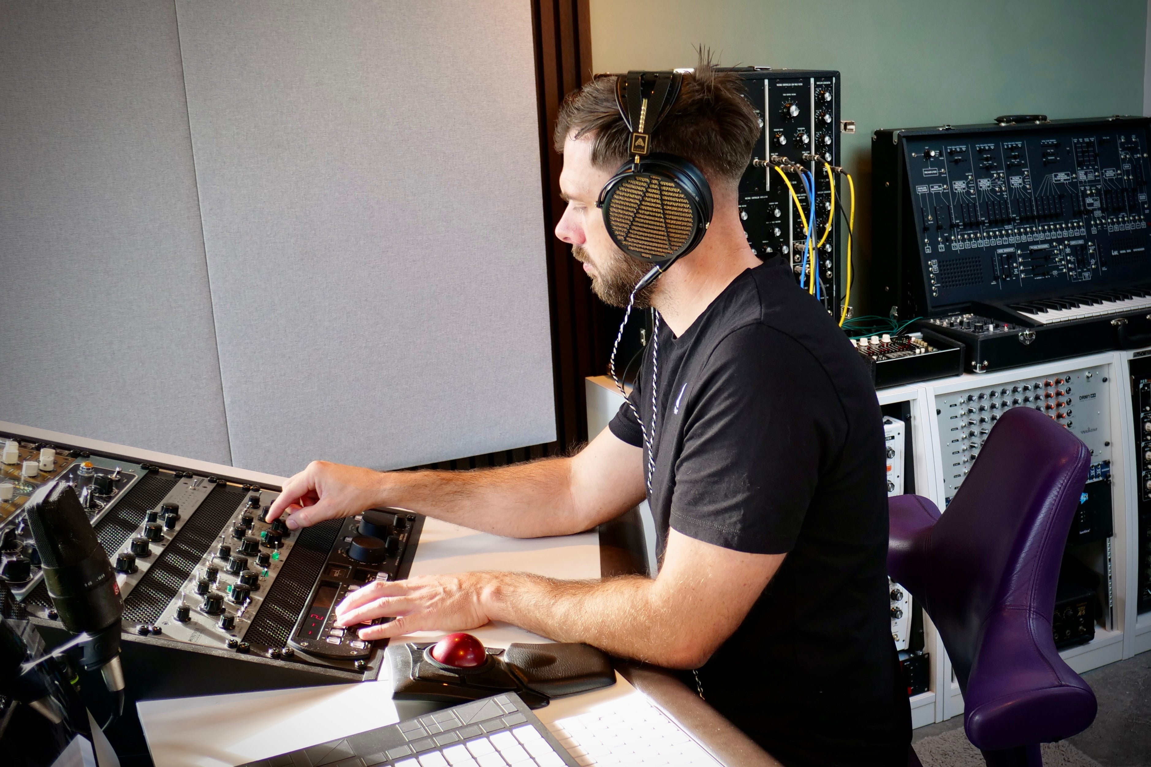 Neil wearing Audeze LCD-4z headphones in the studio