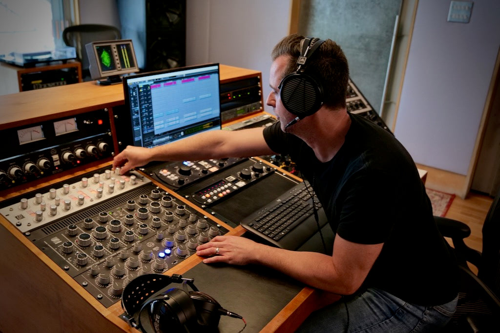 Matt Colton wearing Audeze LCD-MX4 headphones mixing