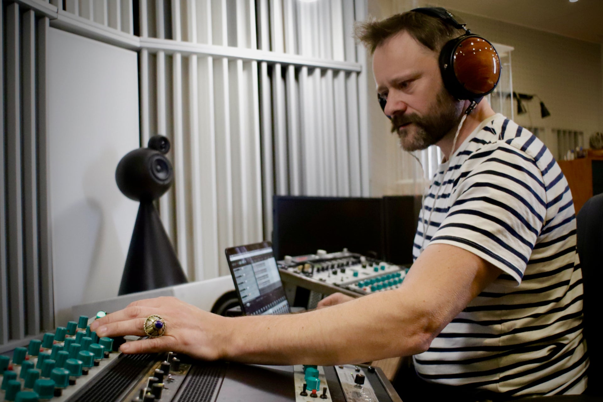 Petter Berndalen wearing Audeze LCD-XC headphones in the studio