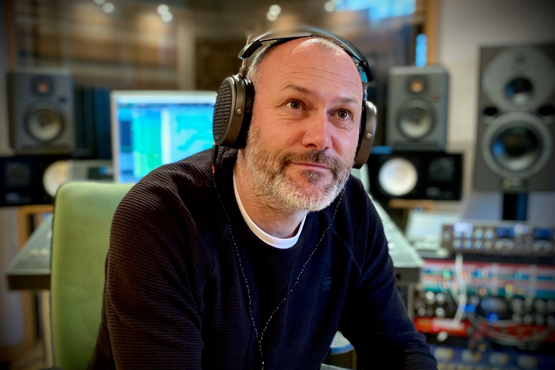 Roman Kašník in the studio with his Audeze MM-500 headphones