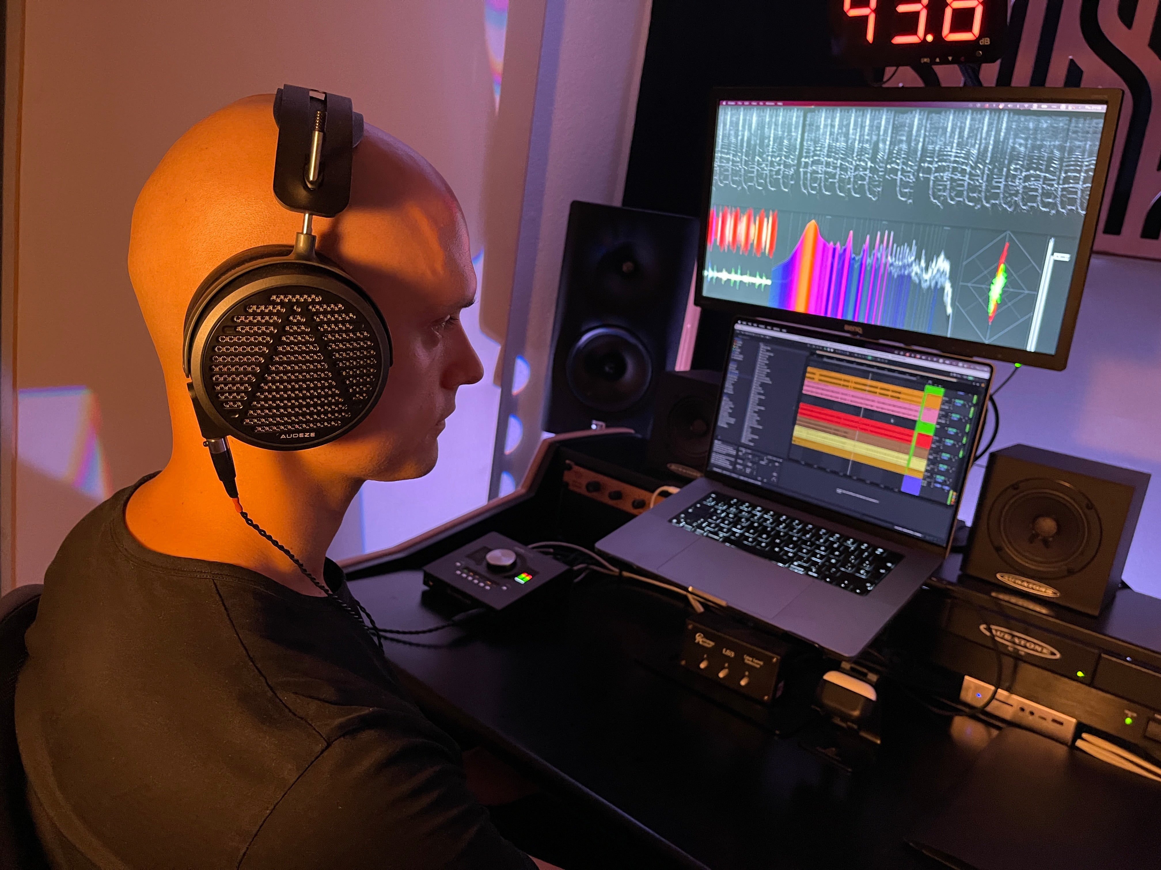 Ruslan wearing Audeze MM-500 headphones mixing