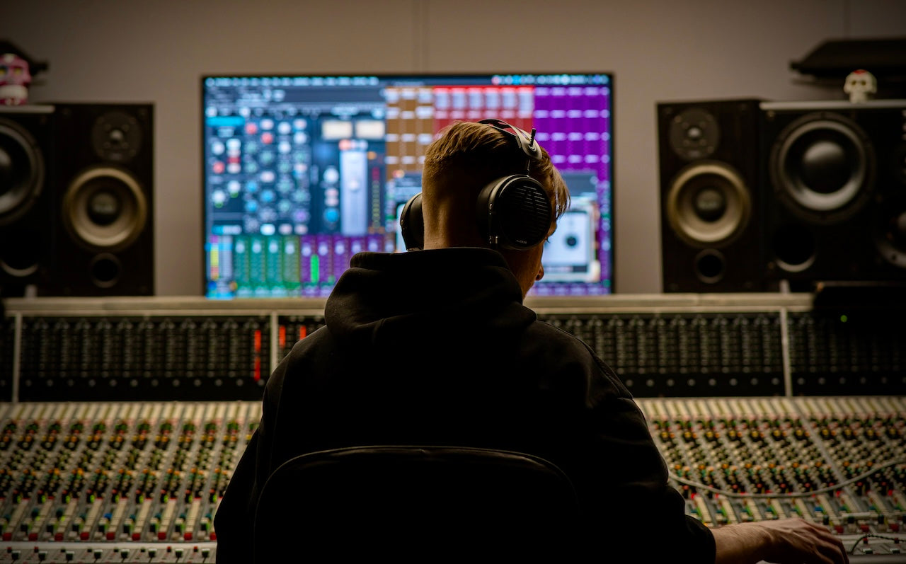 Roman wearing Audeze MM-500 headphones in the studio