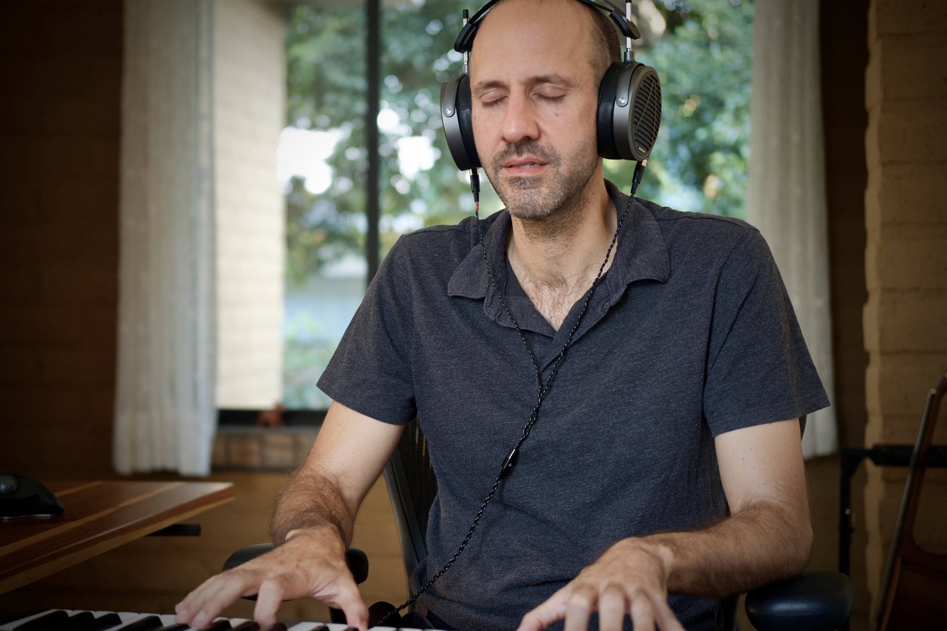 Ricardo Wheelock in the studio with his Audeze MM-500 headphones