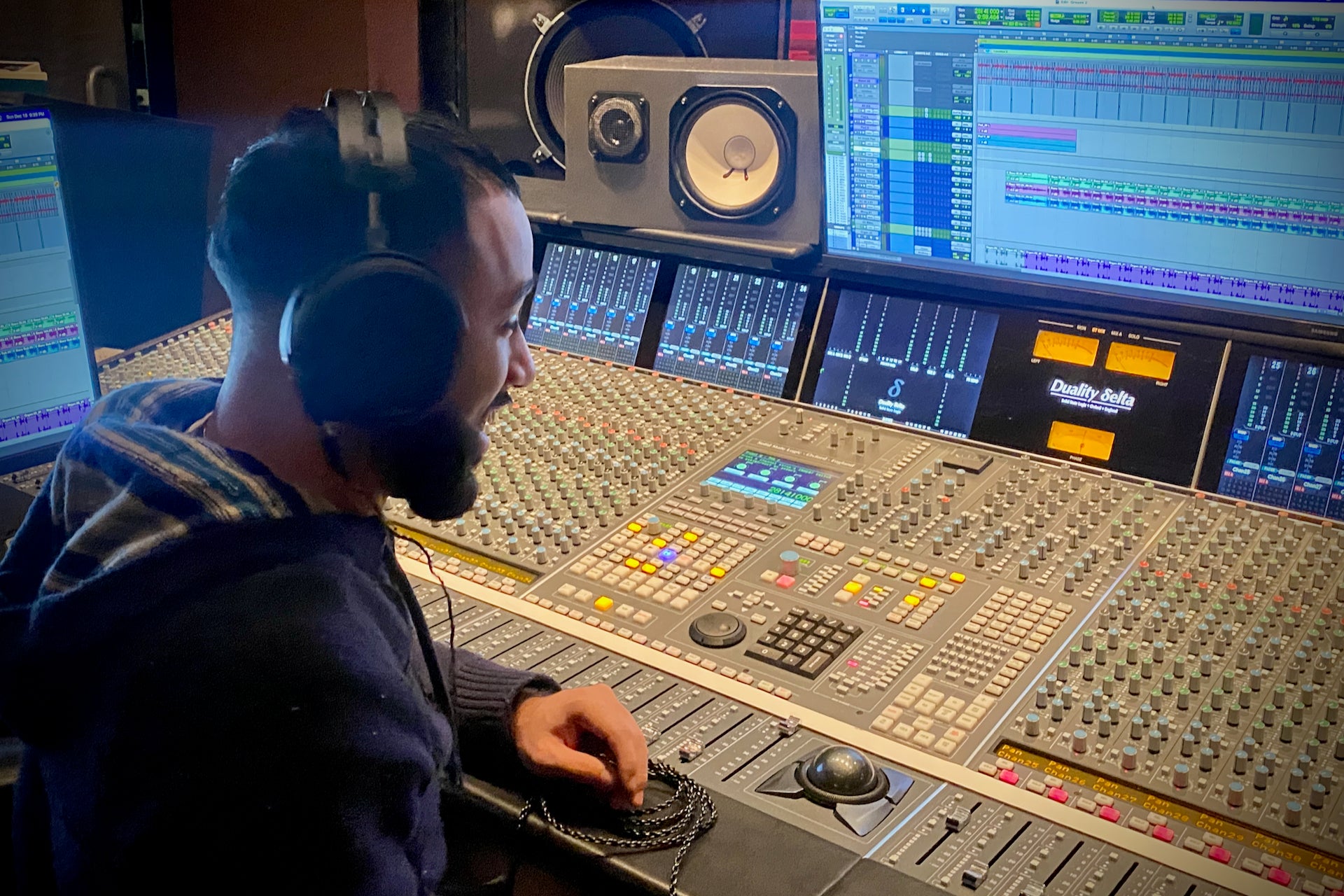 Steven "RAWQWLTY" Tejeda in the studio with his Audeze MM-500 headphones
