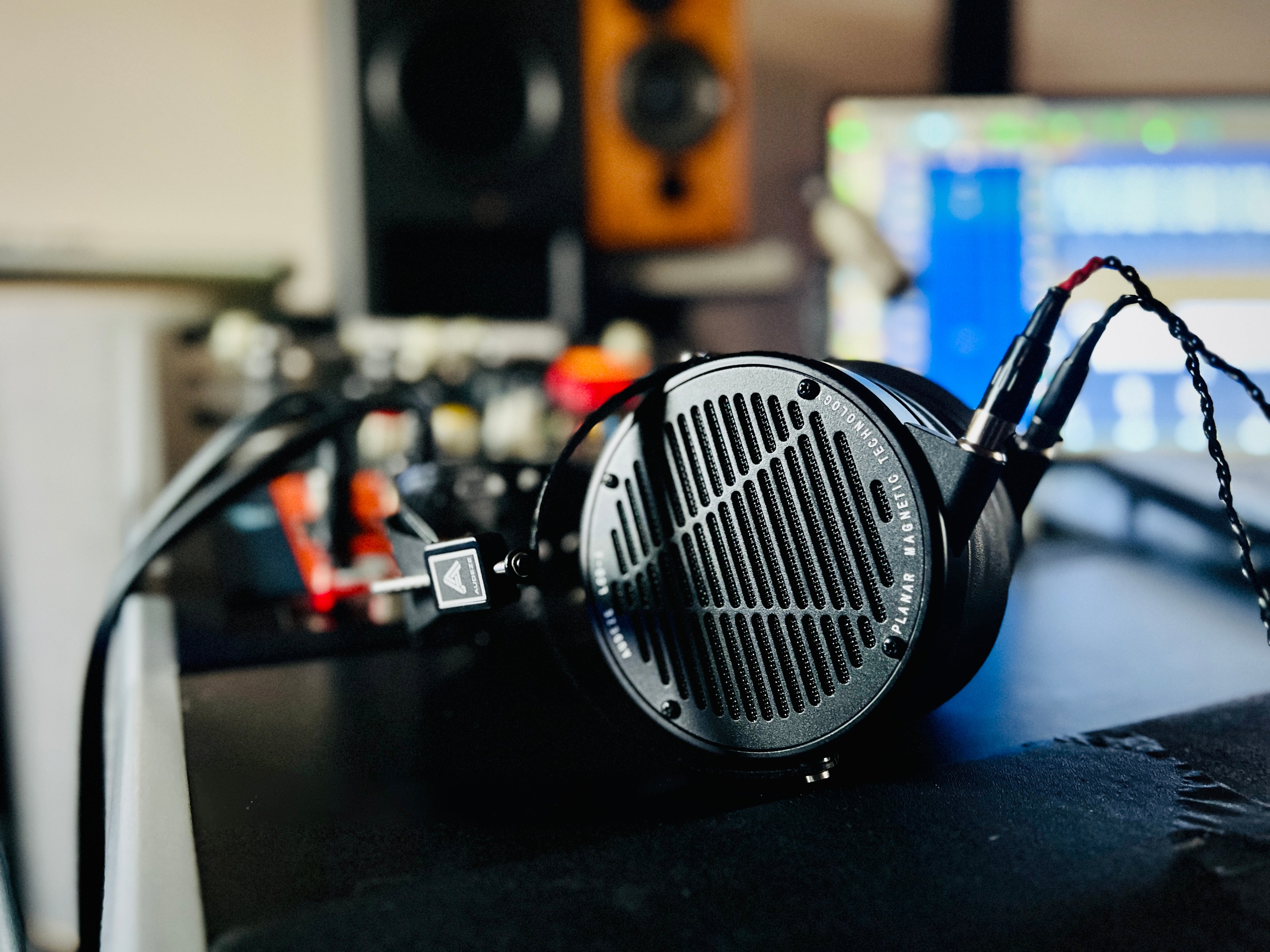 Audeze LCD-X headphones laying on a table in the studio
