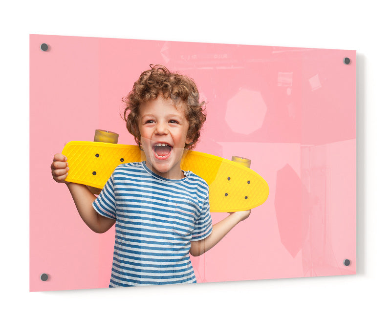 Acrylic Print of a Photo of a ChildHolding a Skateboard and Smiling