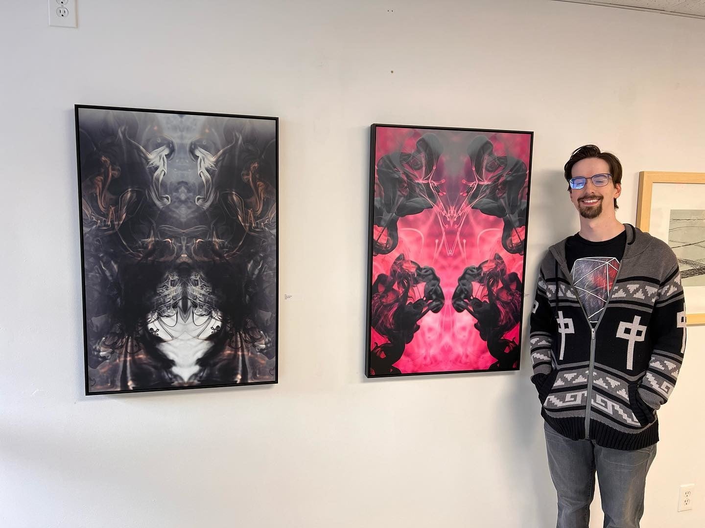 Posterjack Customer and Alberta Artist Standing Beside Metal Prints in Gallery
