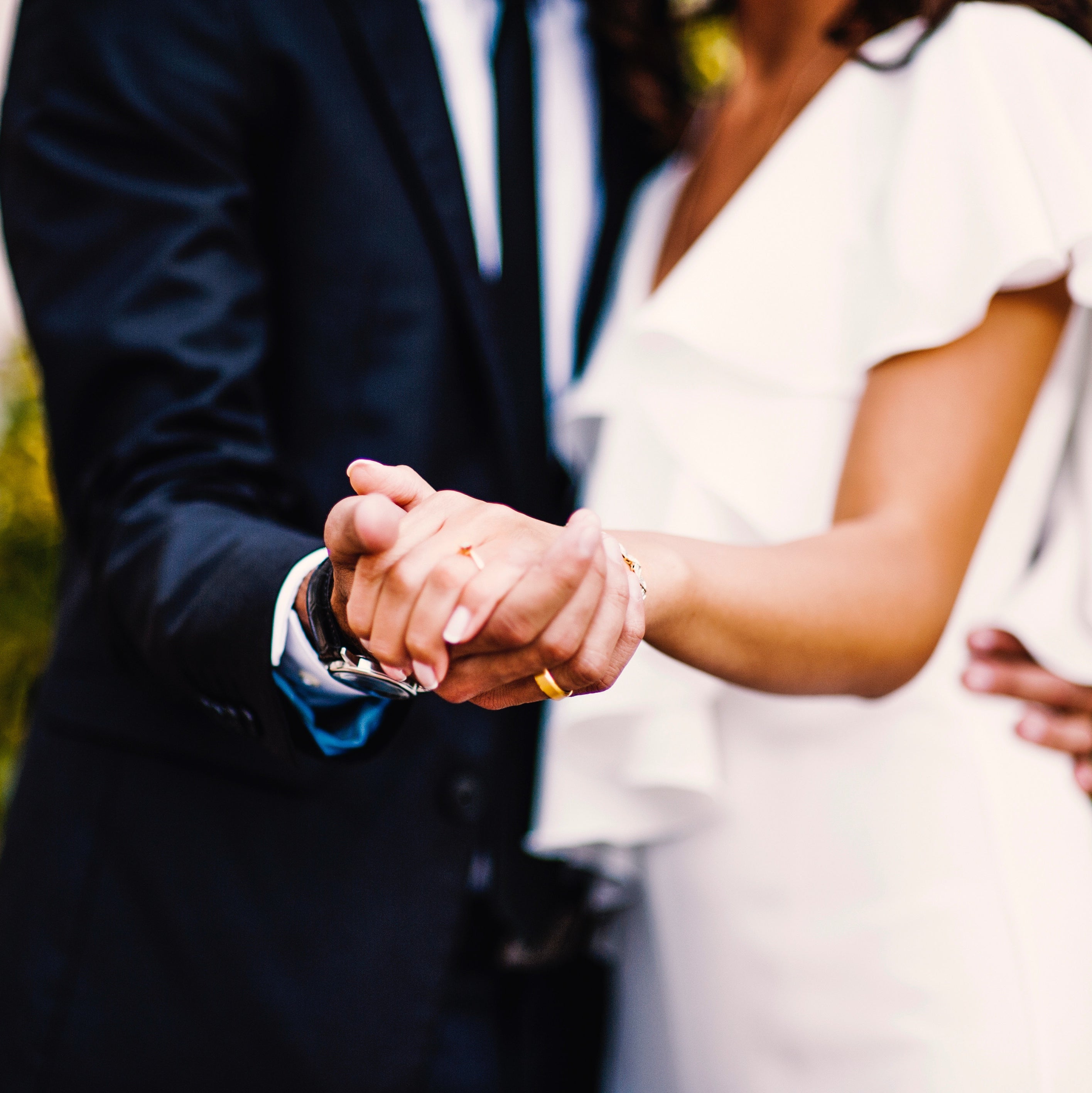 Bride and Groom Hand in Hand Wedding Photo