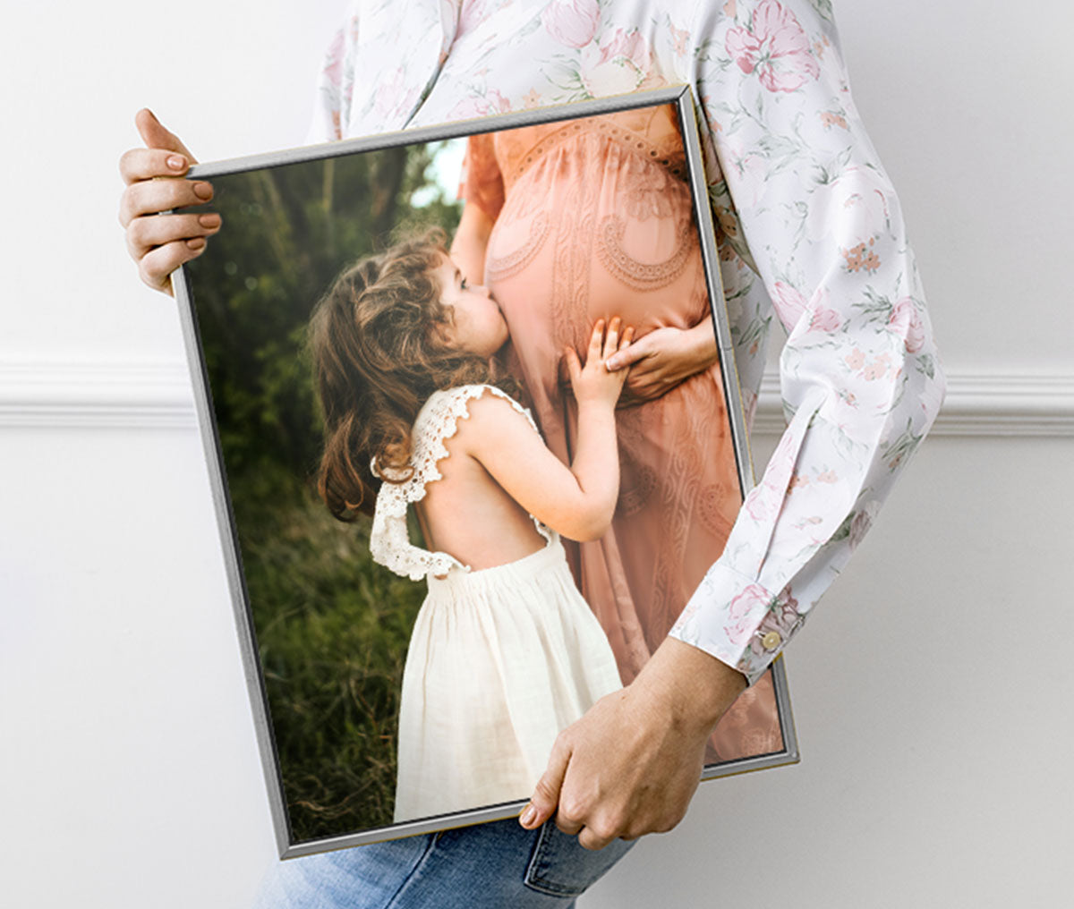 Person Holding a Canvas Print with Floater Frame