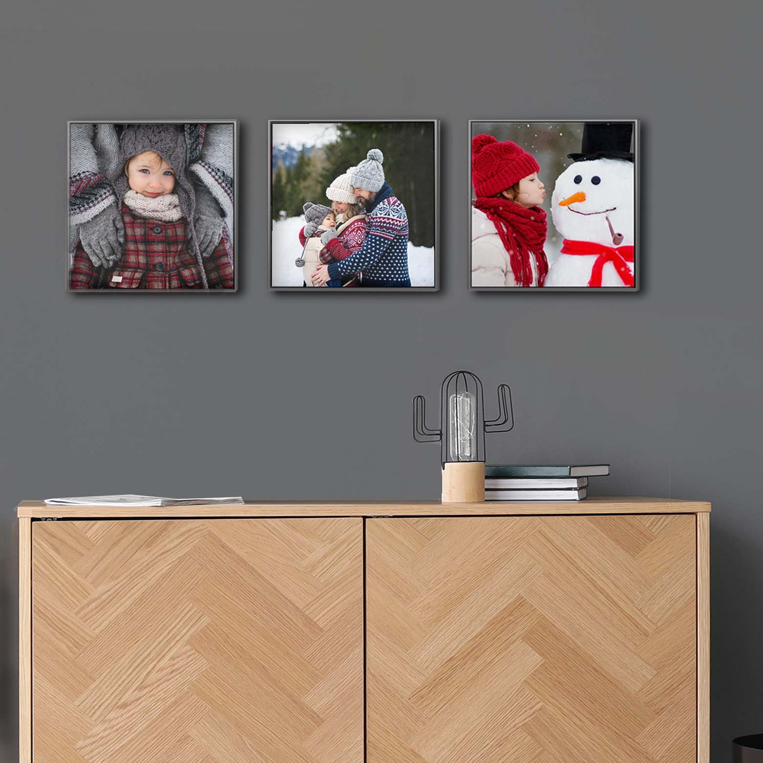 Three square pictures arranged on the wall.