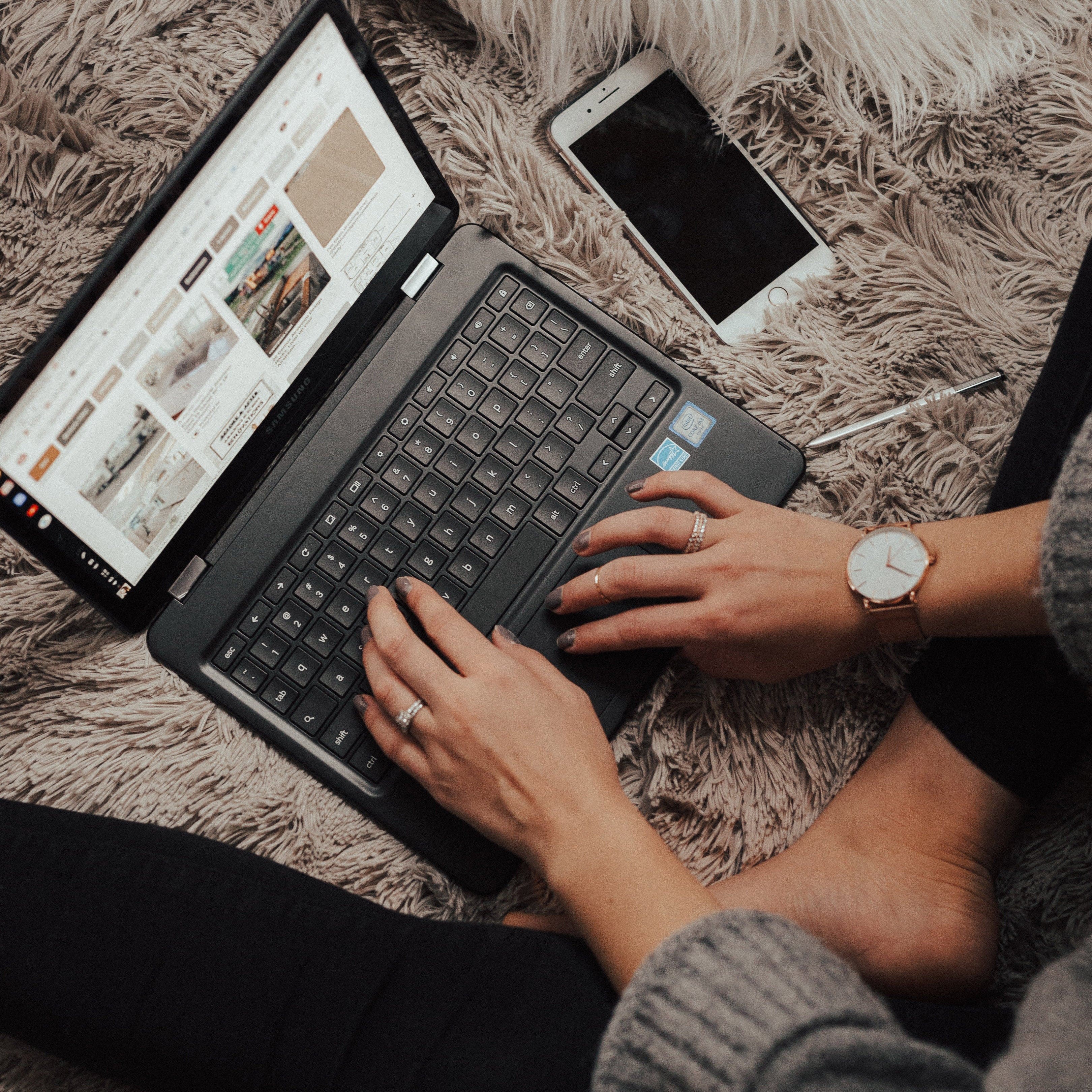 Woman on Laptop Making a Poster