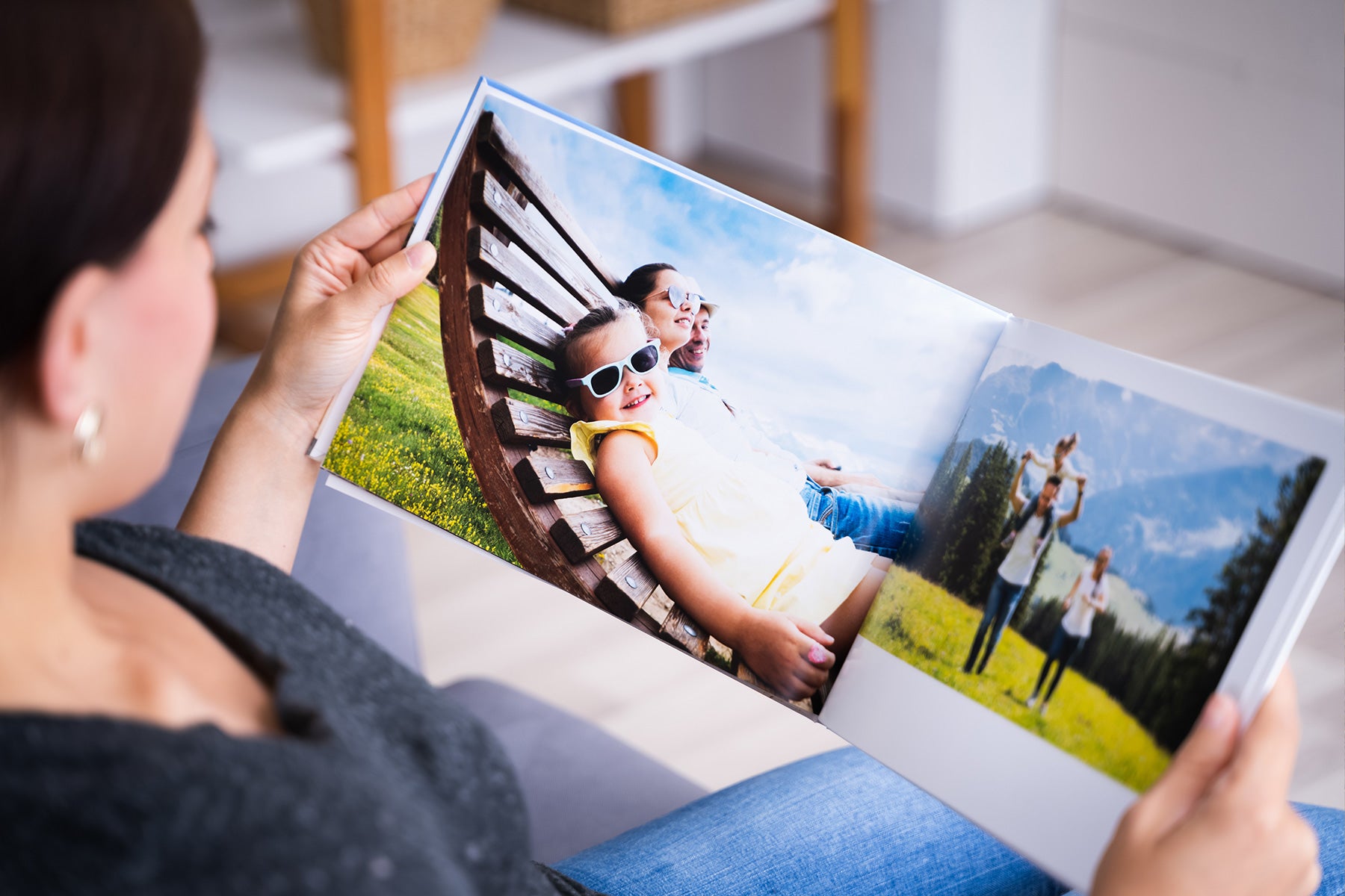 Person looking at photo book full of special family memories