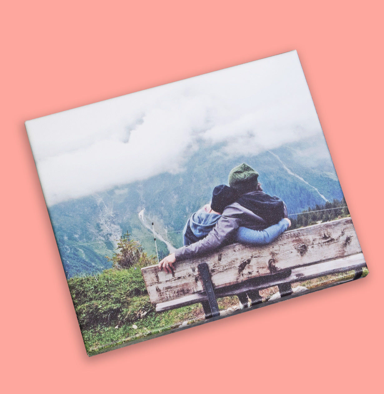 Photo of a couple sitting on a bench printed on canvas by Posterjack