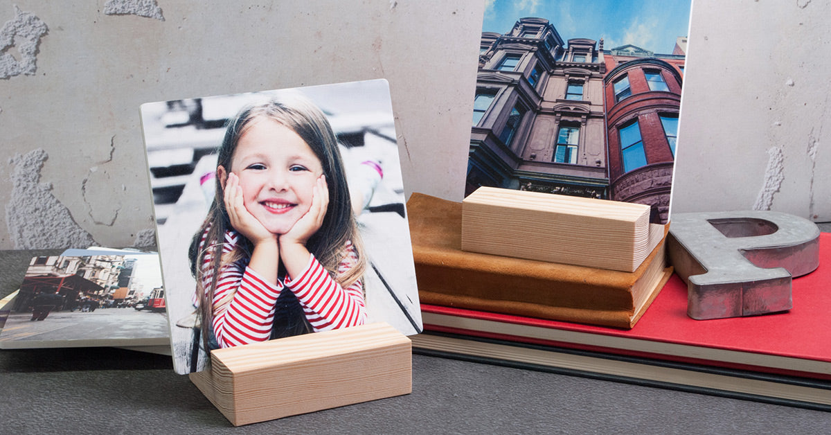 Posterjack Woodstand Prints displayed on a desk.