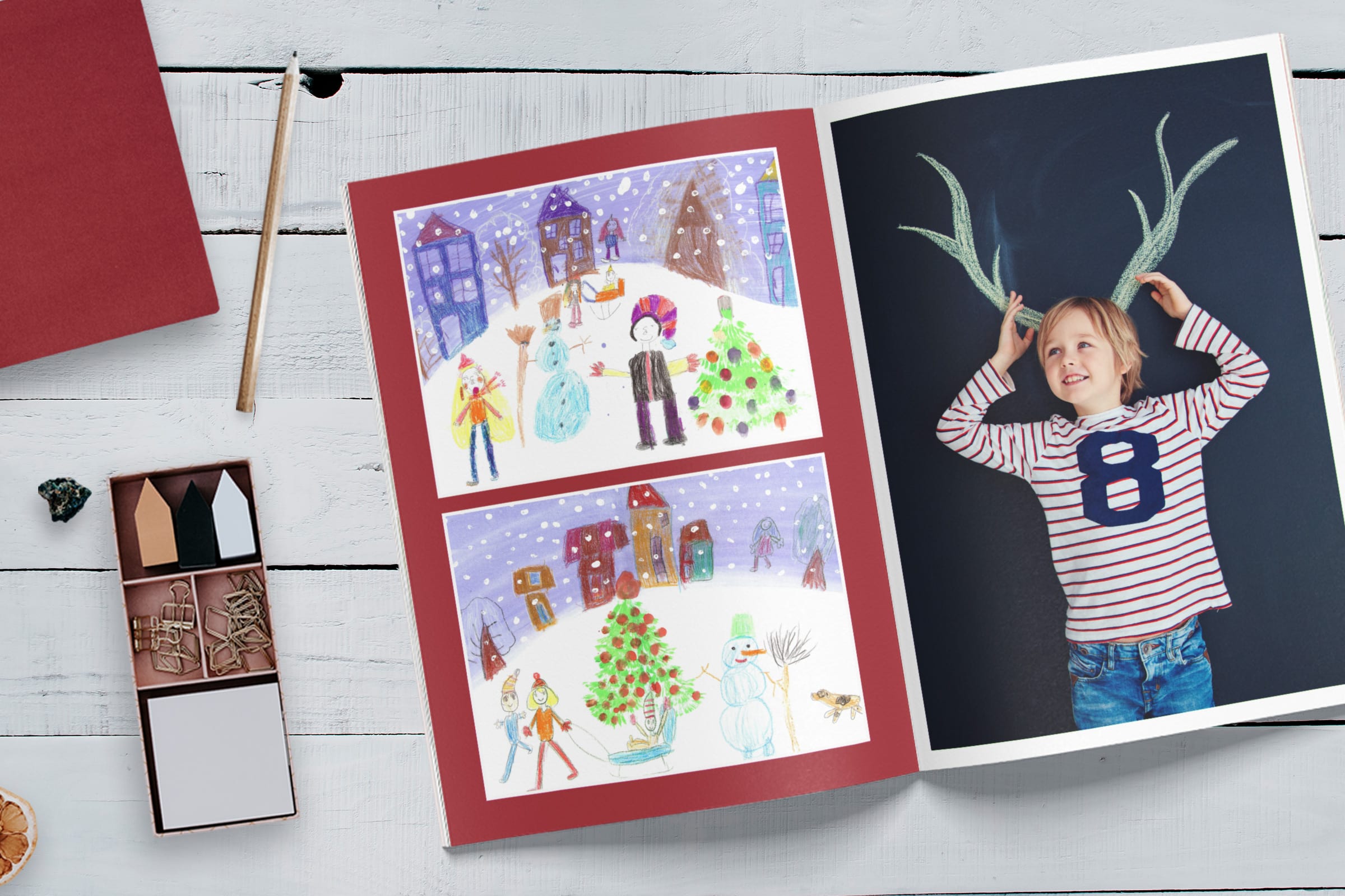 A softcover photo book with a child's artwork and photo on the pages.