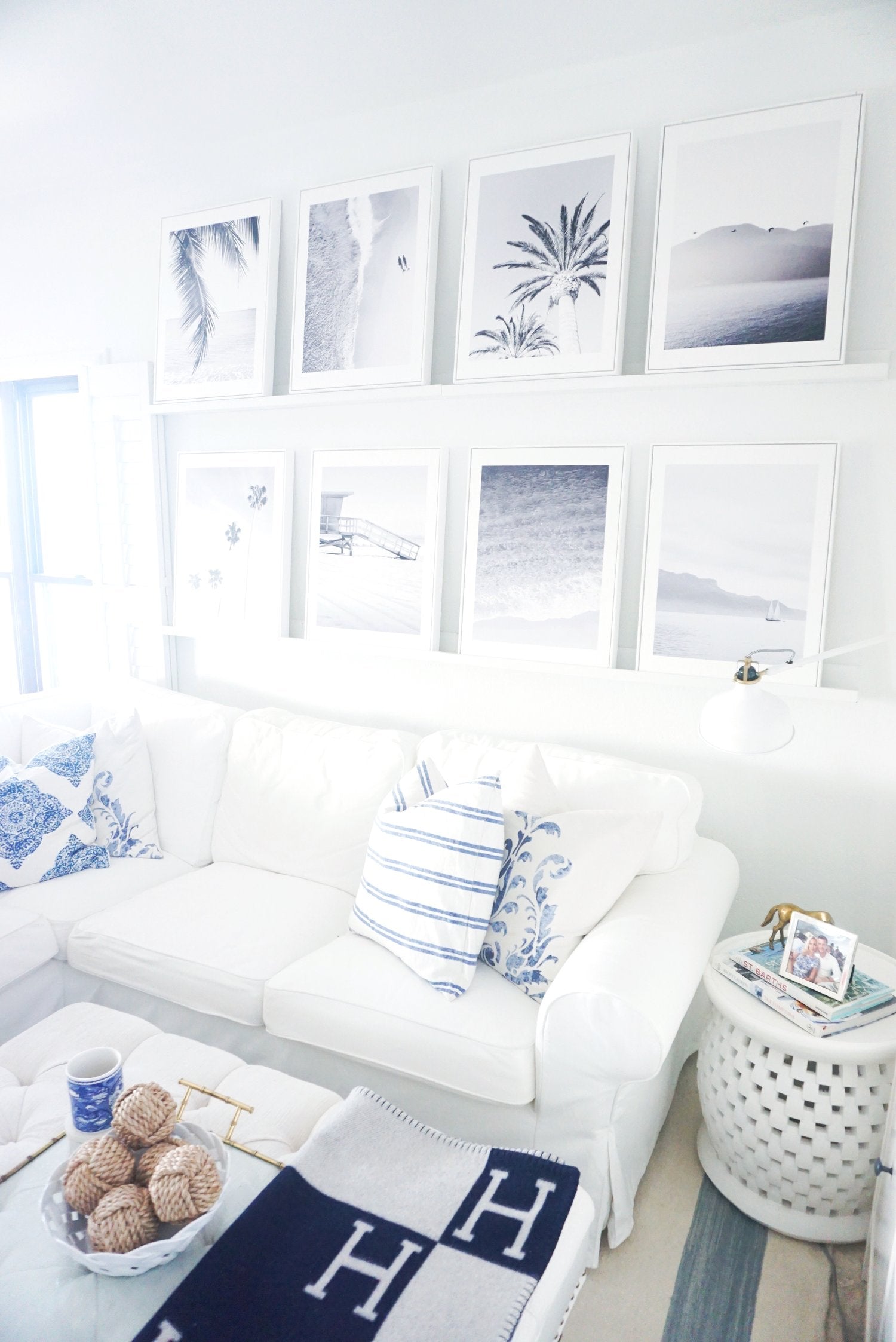 Gallery Wall of White Shadow Box Floater Frames Displayed in Living Room