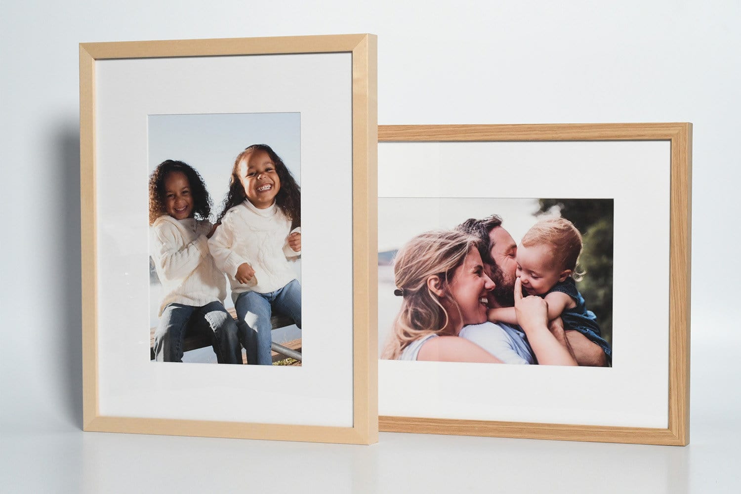 Posterjack natural wood picture frames in clear maple and white oak.