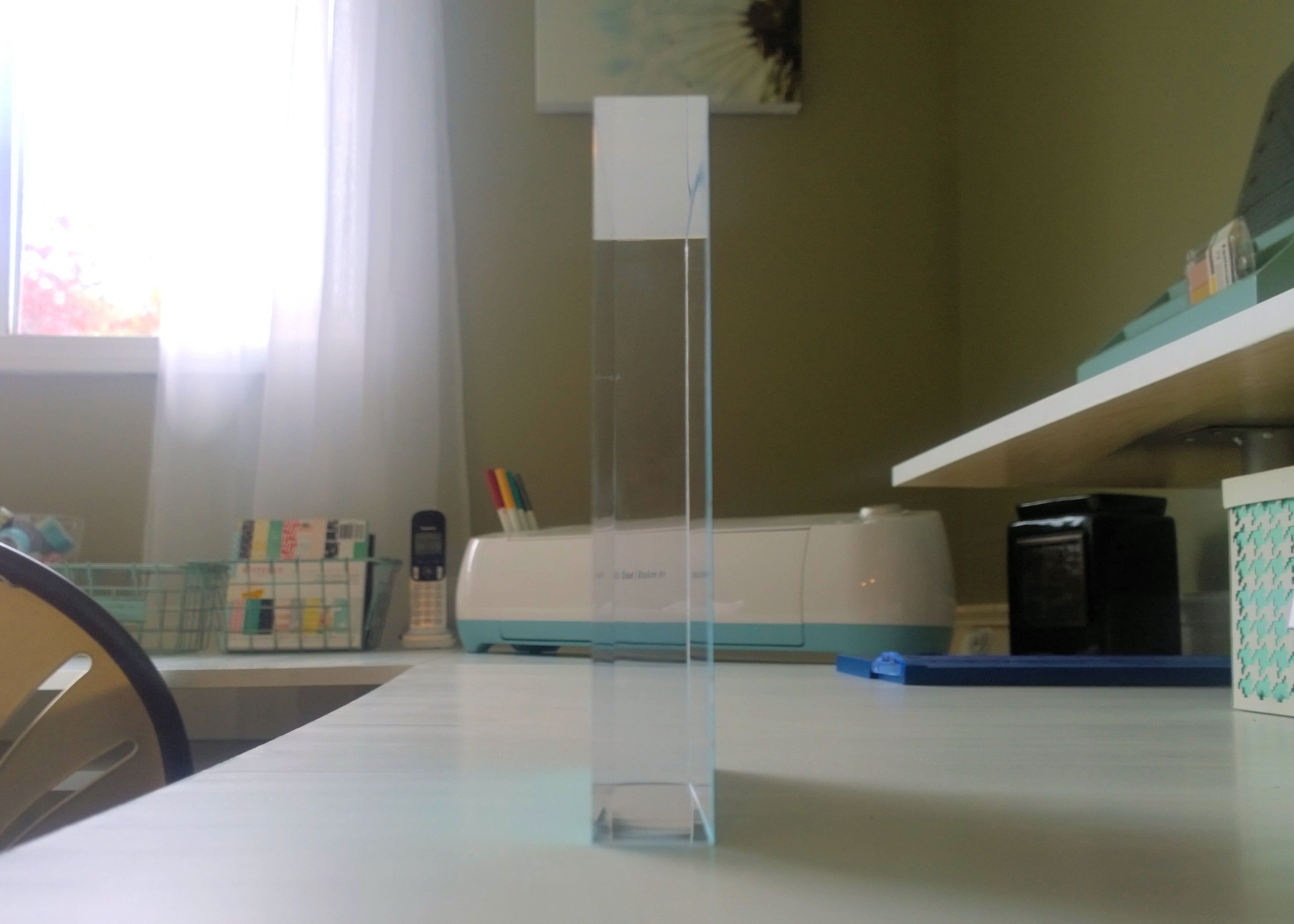 Room makeover project - side view of a Posterjack Acrylic Block desk decor product