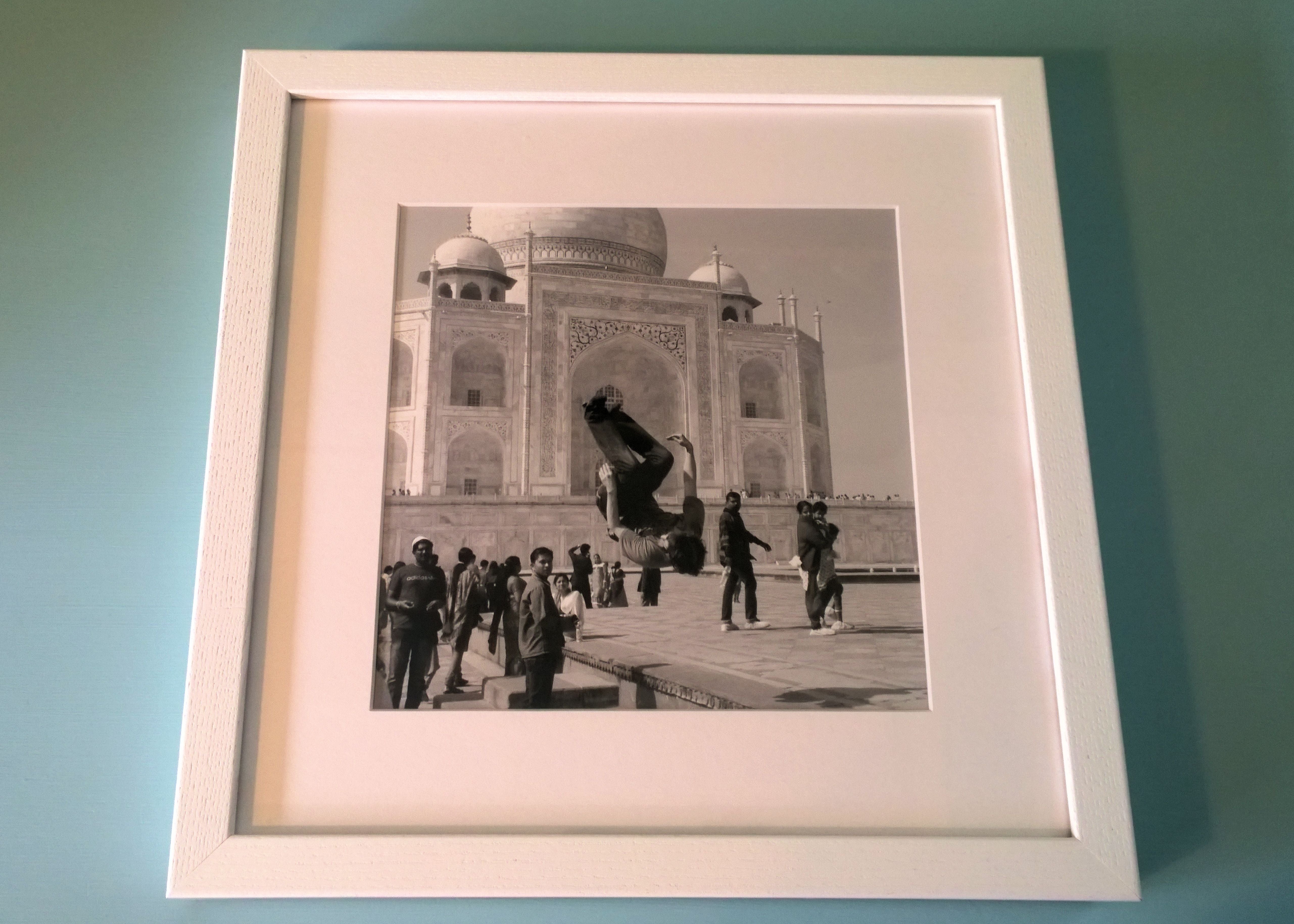 Posterjack Gallery Frame photo of boy doing a flip in front of the Taj Mahal in India