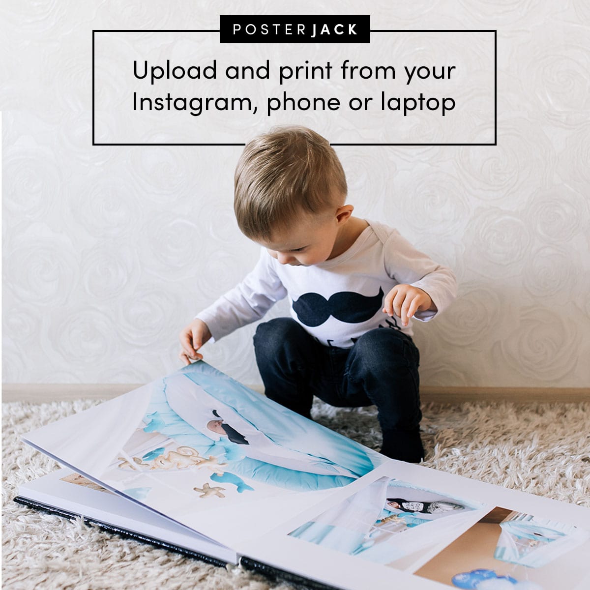 A toddler looking at a Posterjack Layflat Photo Book