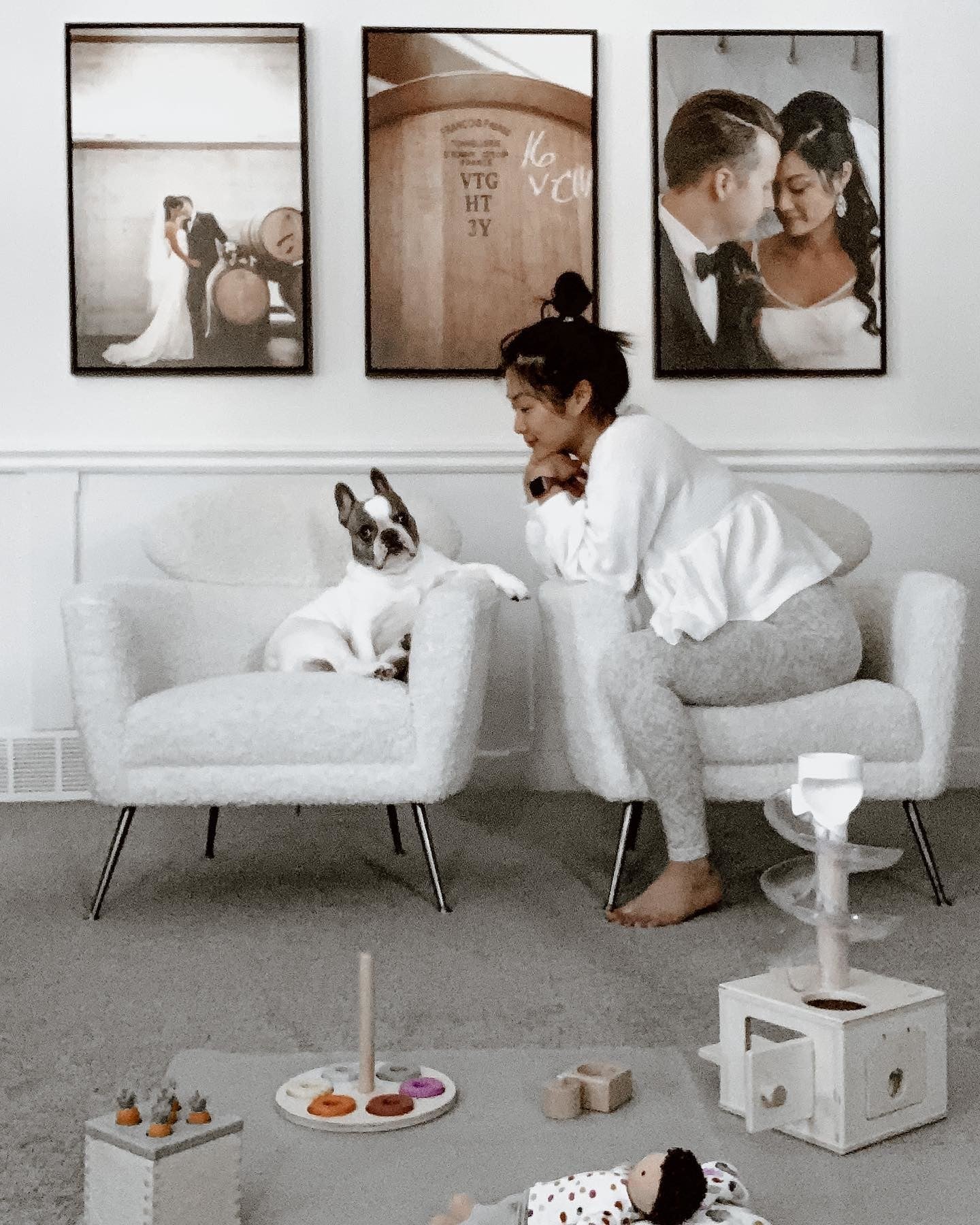 Three Large Canvas Prints Displayed on the Wall with a Person and Dog in the Foreground - Posterjack Customer Photo