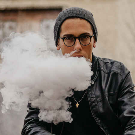 Man Vaping Large Clouds of E-Liquid Vapour