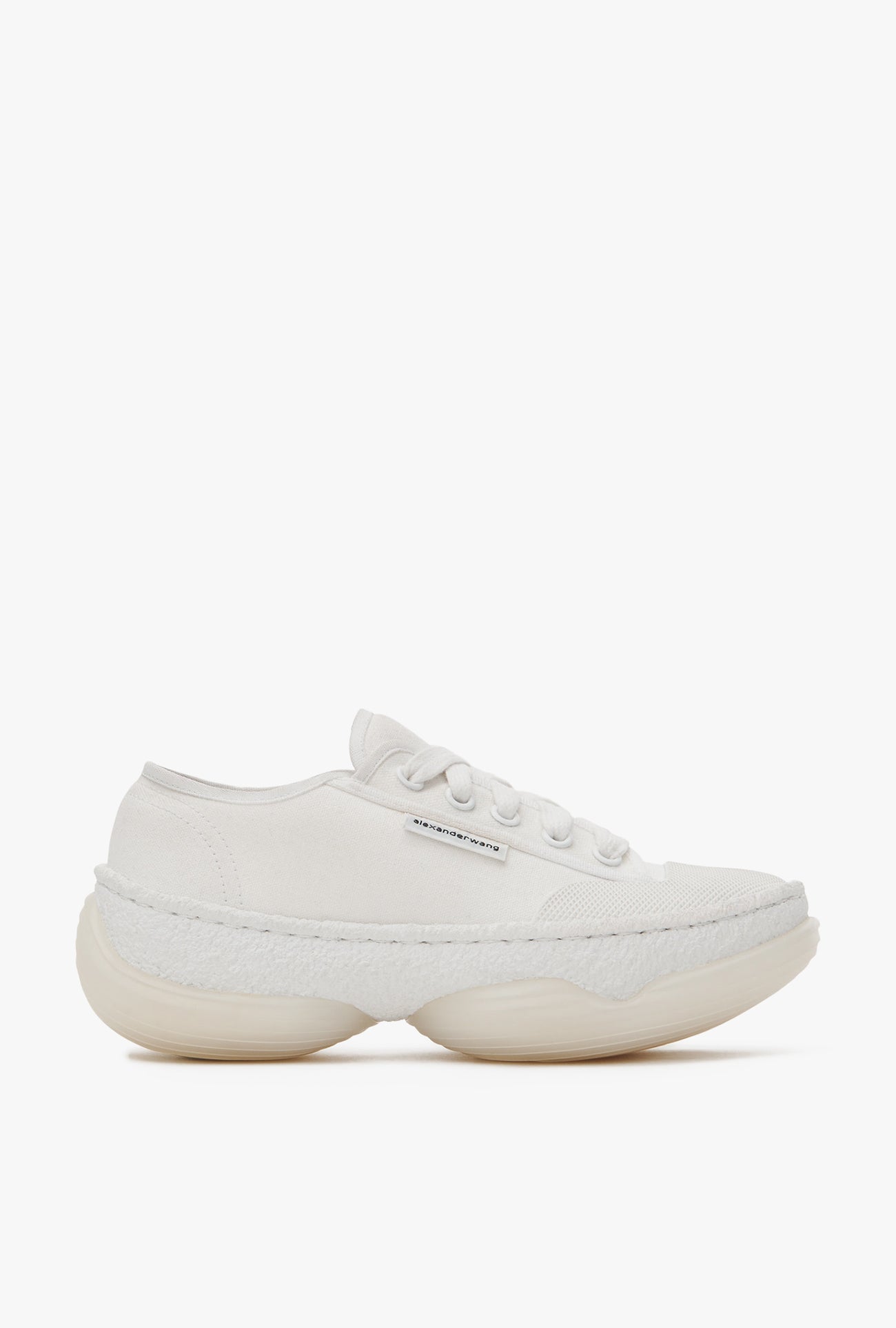 white canvas low top sneakers