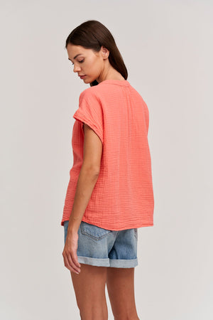 Pamela in grapefruit side shirt