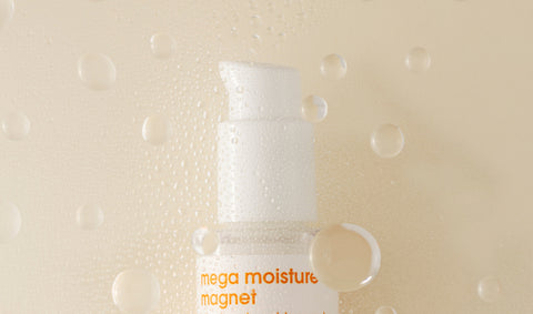 White bottle surrounded by serum bubbles