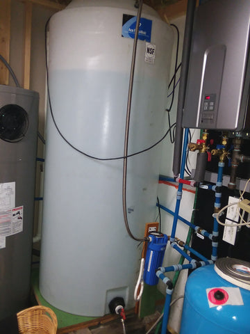 200 gallon water tank, fed by submersible SunPump. Float switches tell Sunpump controller when to turn pump on/off: