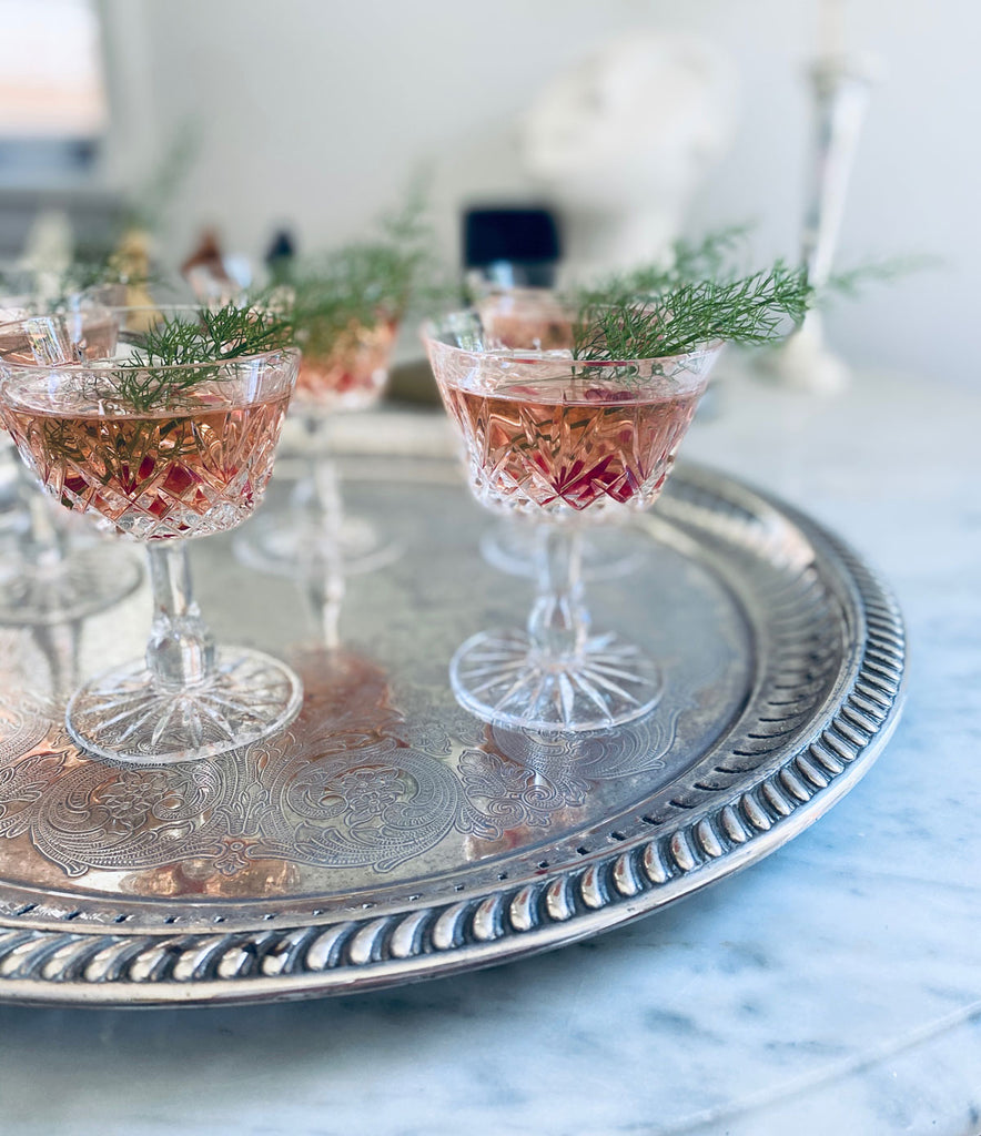 Pink Gin Christmas Cocktail in glasses on silver tray