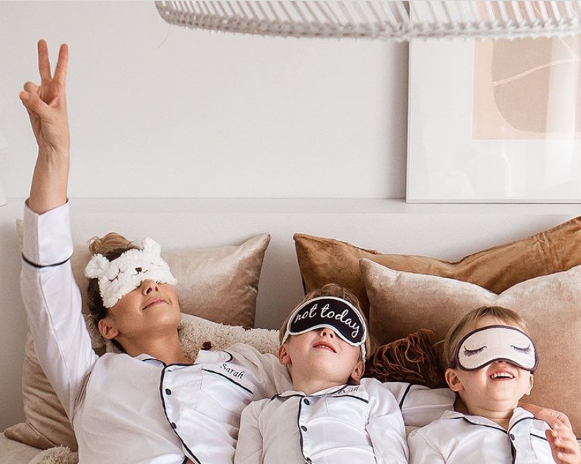 Sarah from @thebearcubclub and her twin boys in their pyjamas and sleep masks
