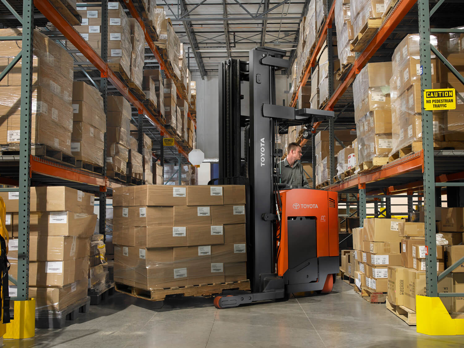 Toyota Electric Reach Truck Turning In Aisle