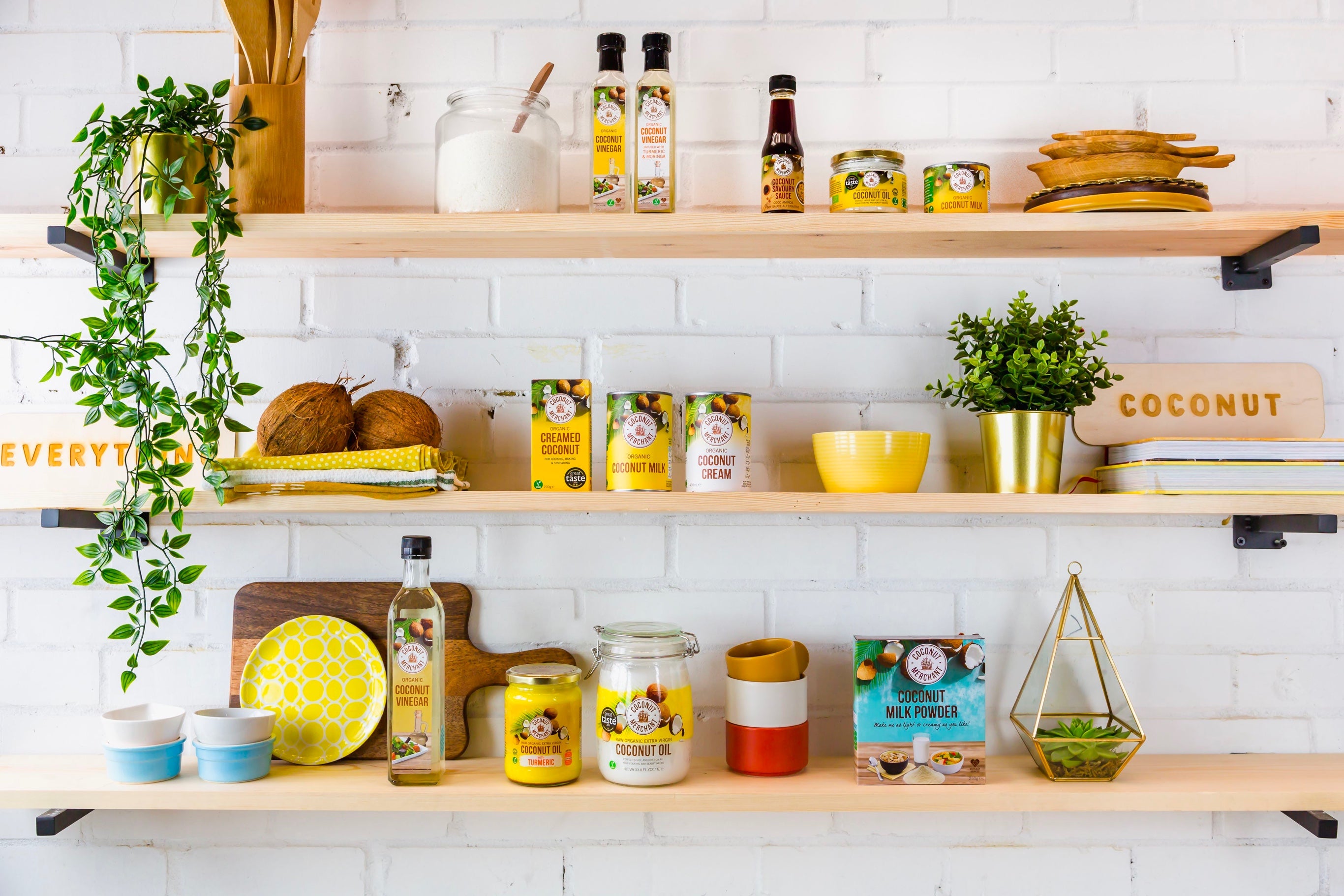 Three shelves with coconut products on them