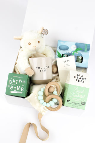 Neutral Baby gift box with items for baby and the new mum.