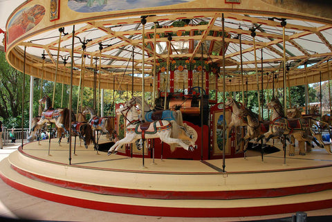 Empty and stopped merry-go-round symbolizing impact of pandemic on global commerce