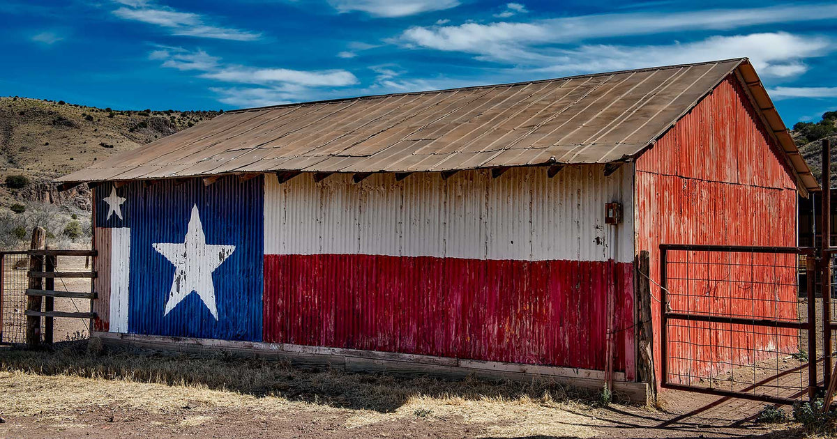 Old barn with Texas flag painted on side