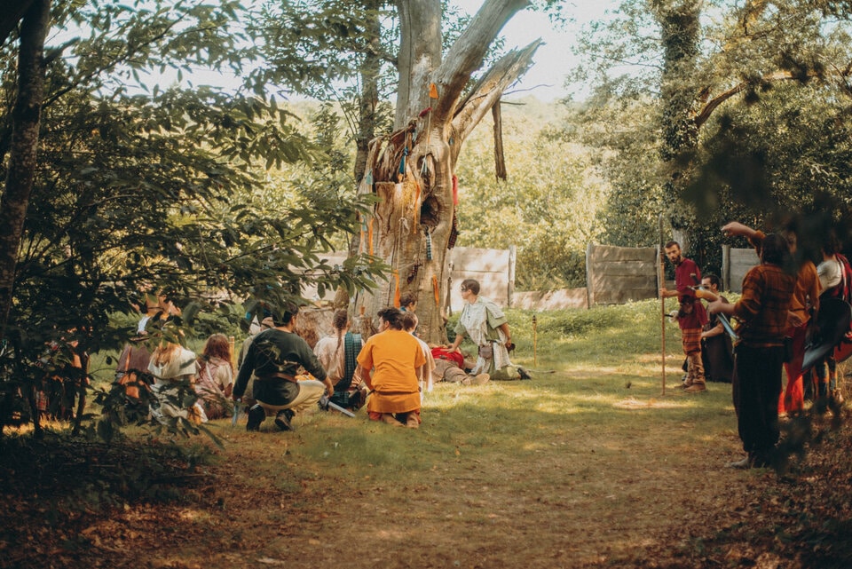 Some larpers resting in a camp