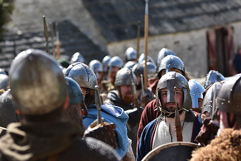 Historical reenactment with soldiers wearing metal helmets