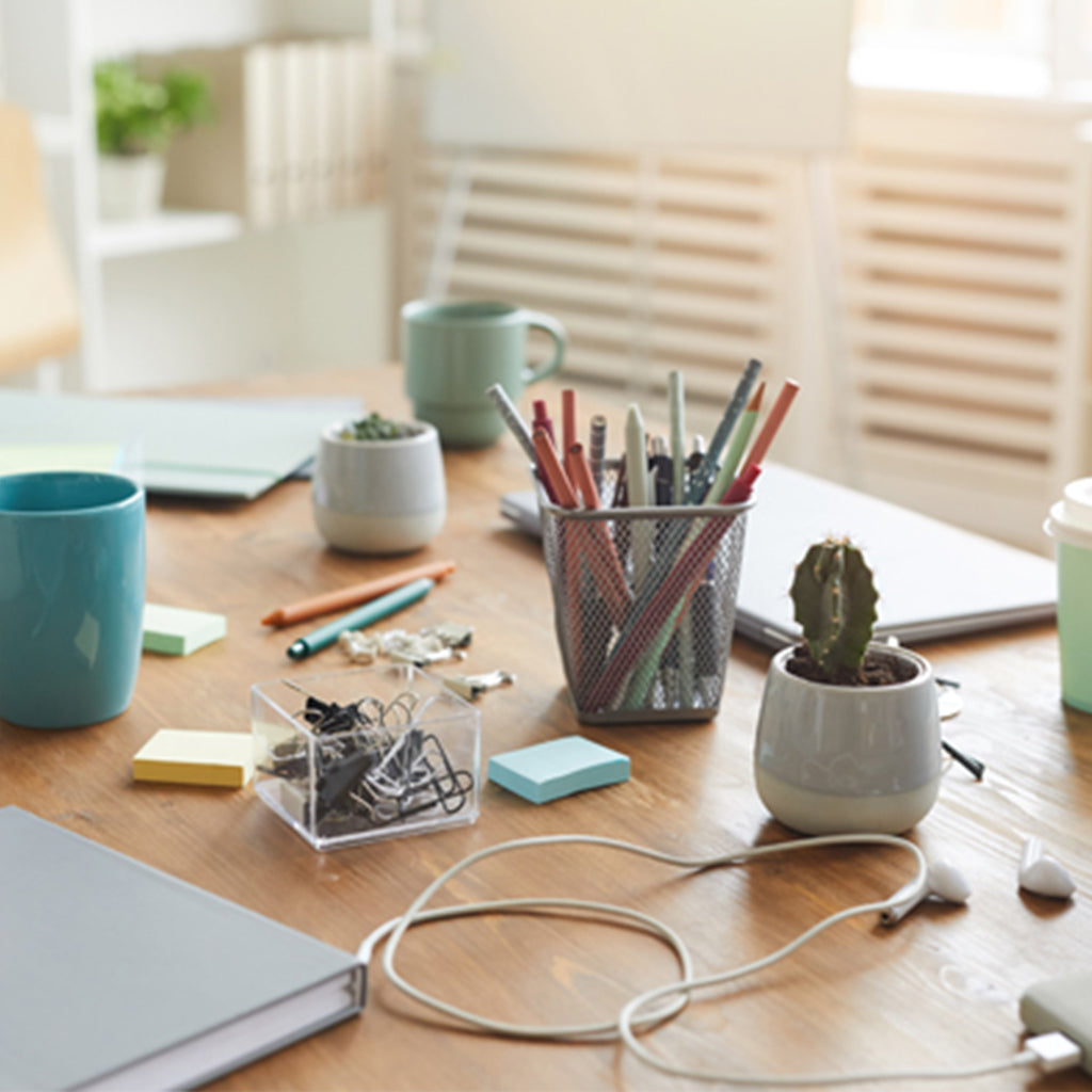 cluttered desk at home office