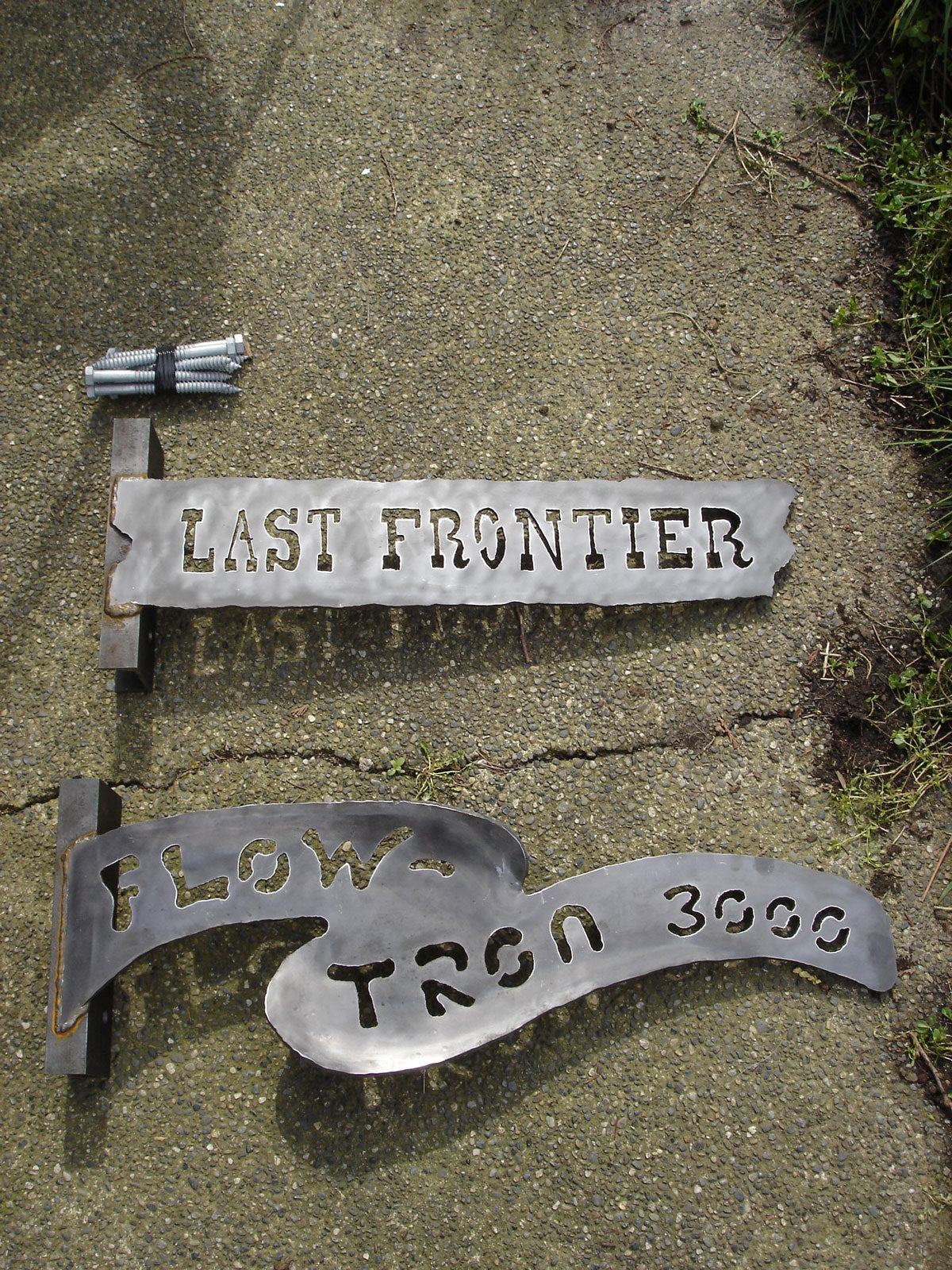 Last Frontier & Flowtron 3000 signs - Tokul