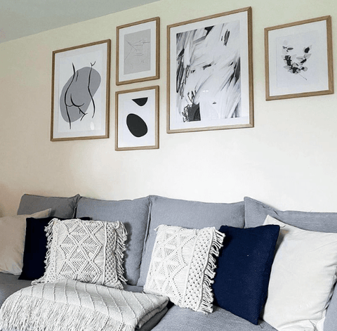 framed gallery wall art above sofa in living room