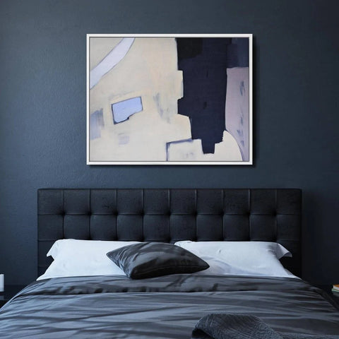 framed canvas above bed